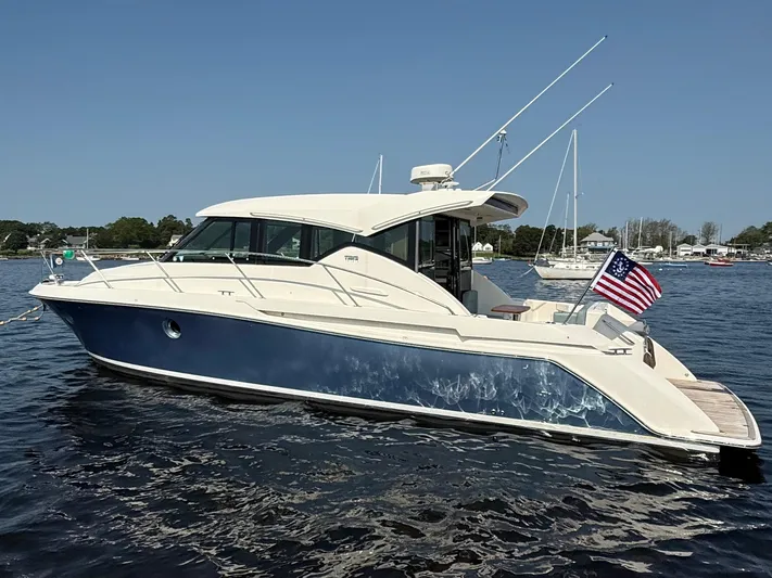 Silver Lining, Name Reserved Yacht Photos Pics 2017 Tiara Yachts 39 Coupe on water, displaying sleek design and American flag.