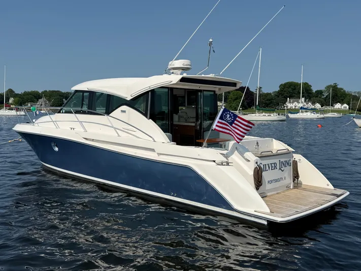 Silver Lining, Name Reserved Yacht Photos Pics 2017 Tiara Yachts 39 Coupe on water, displaying American flag, docked in marina.