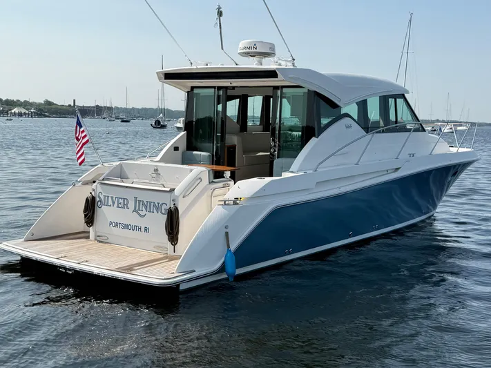 Silver Lining, Name Reserved Yacht Photos Pics 2017 Tiara Yachts 39 Coupe on water, rear view with American flag.