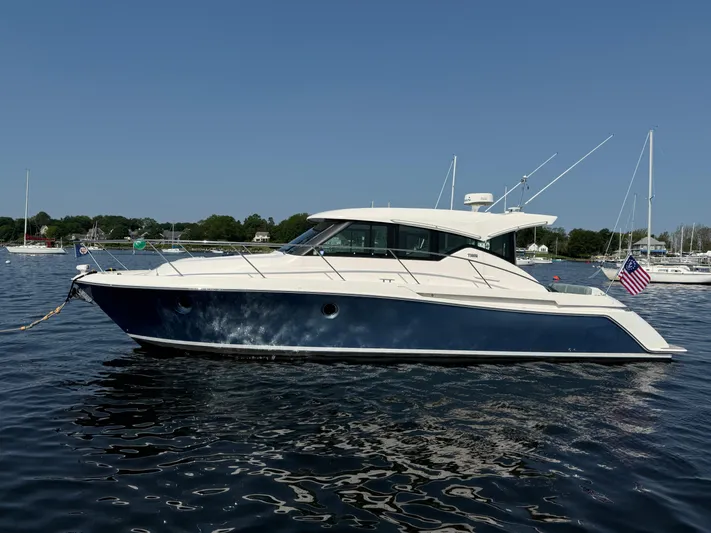 Silver Lining, Name Reserved Yacht Photos Pics 2017 Tiara Yachts 39 Coupe on water, side view with American flag.