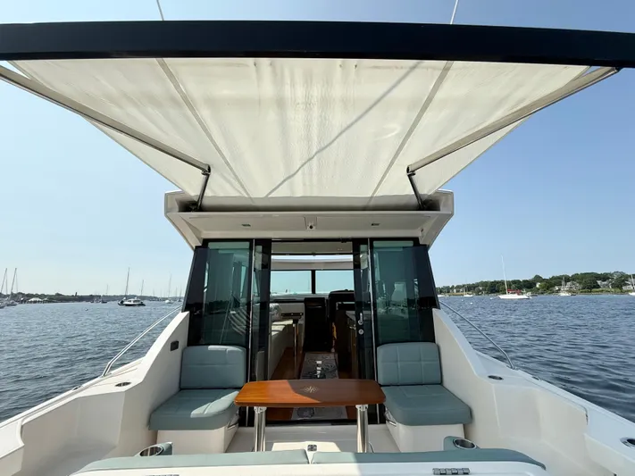 Silver Lining, Name Reserved Yacht Photos Pics 2017 Tiara Yachts 39 Coupe with open deck, seating, and scenic water view.