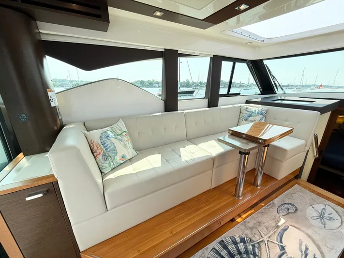 Silver Lining, Name Reserved Yacht Photos Pics Luxurious interior of 2017 Tiara Yachts 39 Coupe with elegant seating and decor.