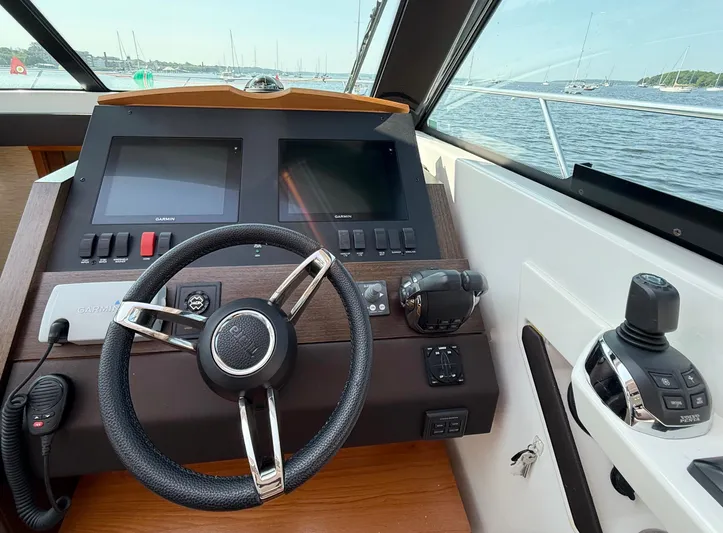 Silver Lining, Name Reserved Yacht Photos Pics Helm of 2017 Tiara Yachts 39 Coupe with dual screens and steering wheel.