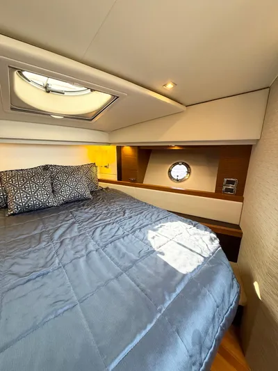 Silver Lining, Name Reserved Yacht Photos Pics Luxurious bedroom interior of 2017 Tiara Yachts 39 Coupe with skylight and porthole.