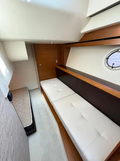 Silver Lining, Name Reserved Yacht Photos Pics 2017 Tiara Yachts 39 Coupe interior with modern seating and porthole window.