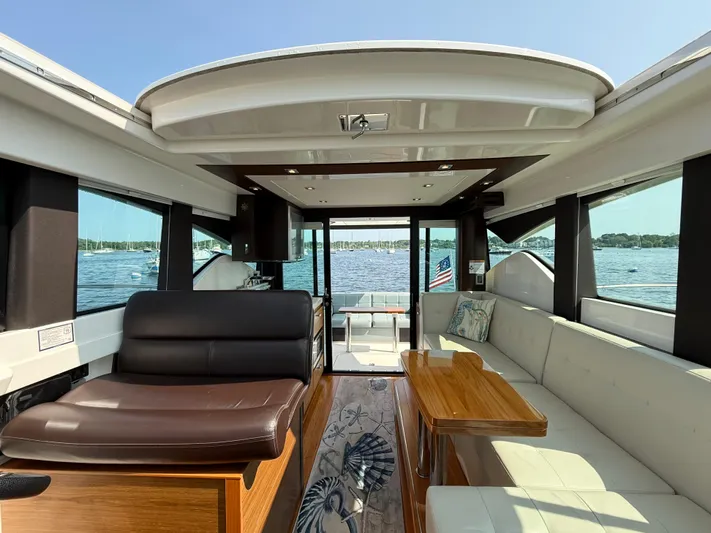 Silver Lining, Name Reserved Yacht Photos Pics Interior of 2017 Tiara Yachts 39 Coupe with elegant seating and scenic water view.