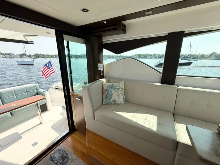 Silver Lining, Name Reserved Yacht Photos Pics Interior of 2017 Tiara Yachts 39 Coupe with waterfront view and American flag.