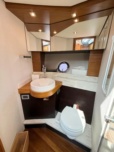 Silver Lining, Name Reserved Yacht Photos Pics 2017 Tiara Yachts 39 Coupe bathroom with modern fixtures and wood accents.