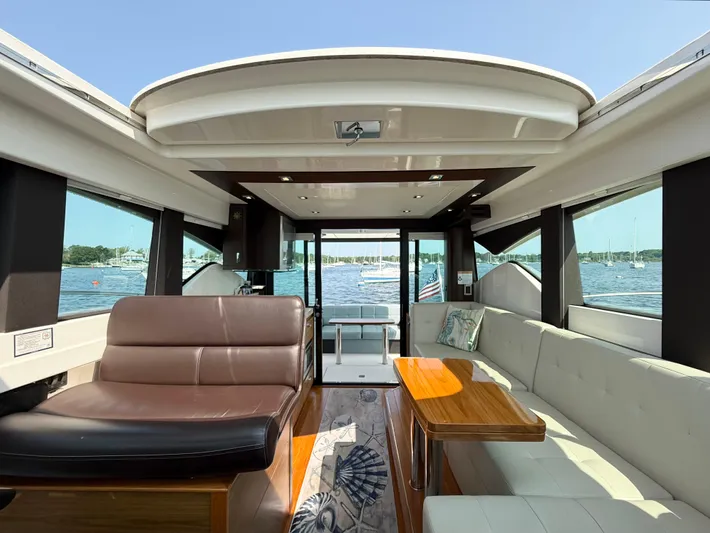 Silver Lining, Name Reserved Yacht Photos Pics Interior of 2017 Tiara Yachts 39 Coupe with luxurious seating and scenic water view.