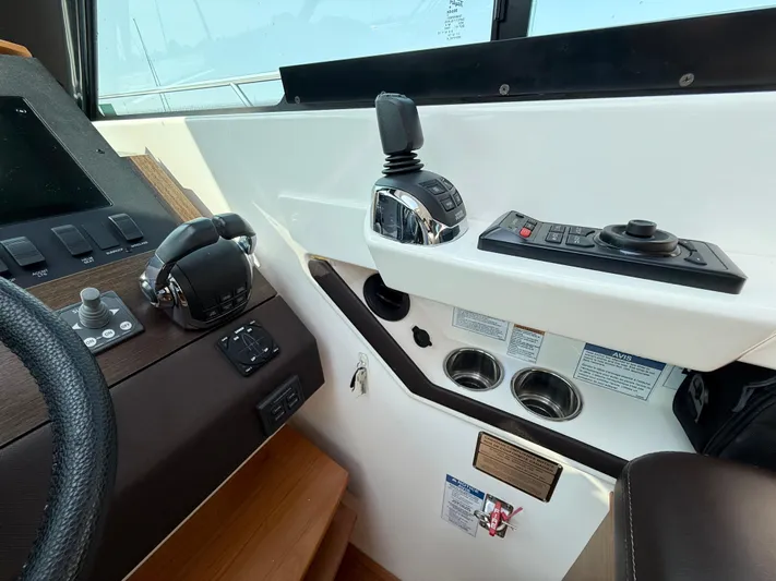 Silver Lining, Name Reserved Yacht Photos Pics Control panel of a 2017 Tiara Yachts 39 Coupe, featuring steering and navigation controls.