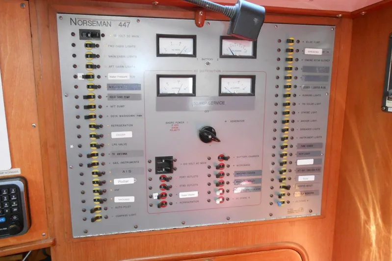Second Kiss Yacht Photos Pics Control panel of a 1989 Norseman 447 boat with various switches and gauges.