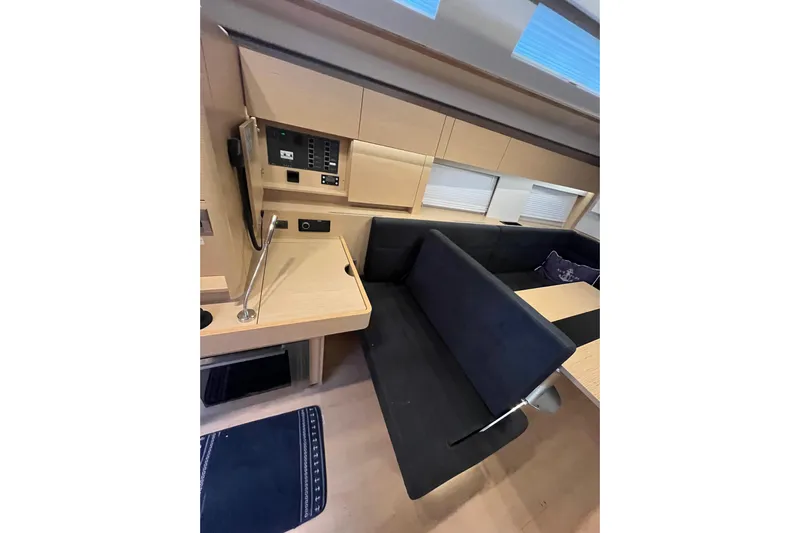  Yacht Photos Pics Interior of 2023 Hanse 588 yacht with modern seating and control panel.