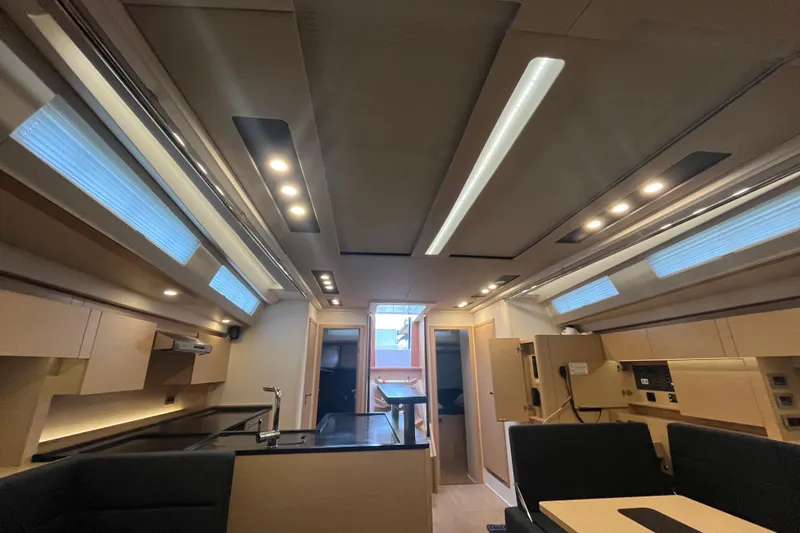  Yacht Photos Pics Luxurious interior of 2023 Hanse 588 yacht, featuring modern lighting and sleek design.