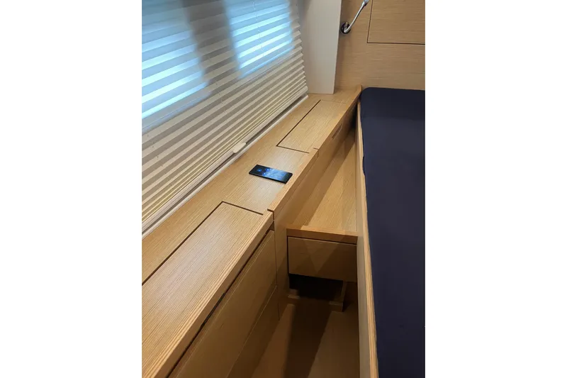  Yacht Photos Pics 2023 Hanse 588 yacht interior with wooden cabinetry and modern design.