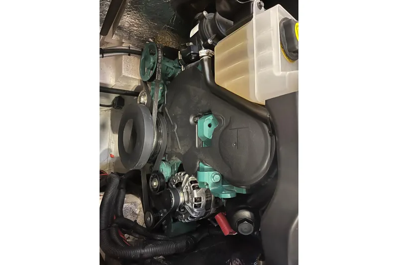  Yacht Photos Pics Engine compartment of 2023 Hanse 588 yacht, featuring mechanical components and fluid reservoir.