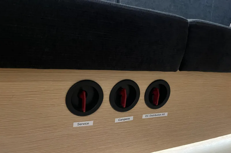  Yacht Photos Pics Control panel on 2023 Hanse 588 yacht with labeled switches: Service, Gangway, DC Distribution Aft.