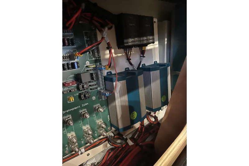  Yacht Photos Pics Electrical components inside 2023 Hanse 588 yacht, featuring circuit boards and wiring.