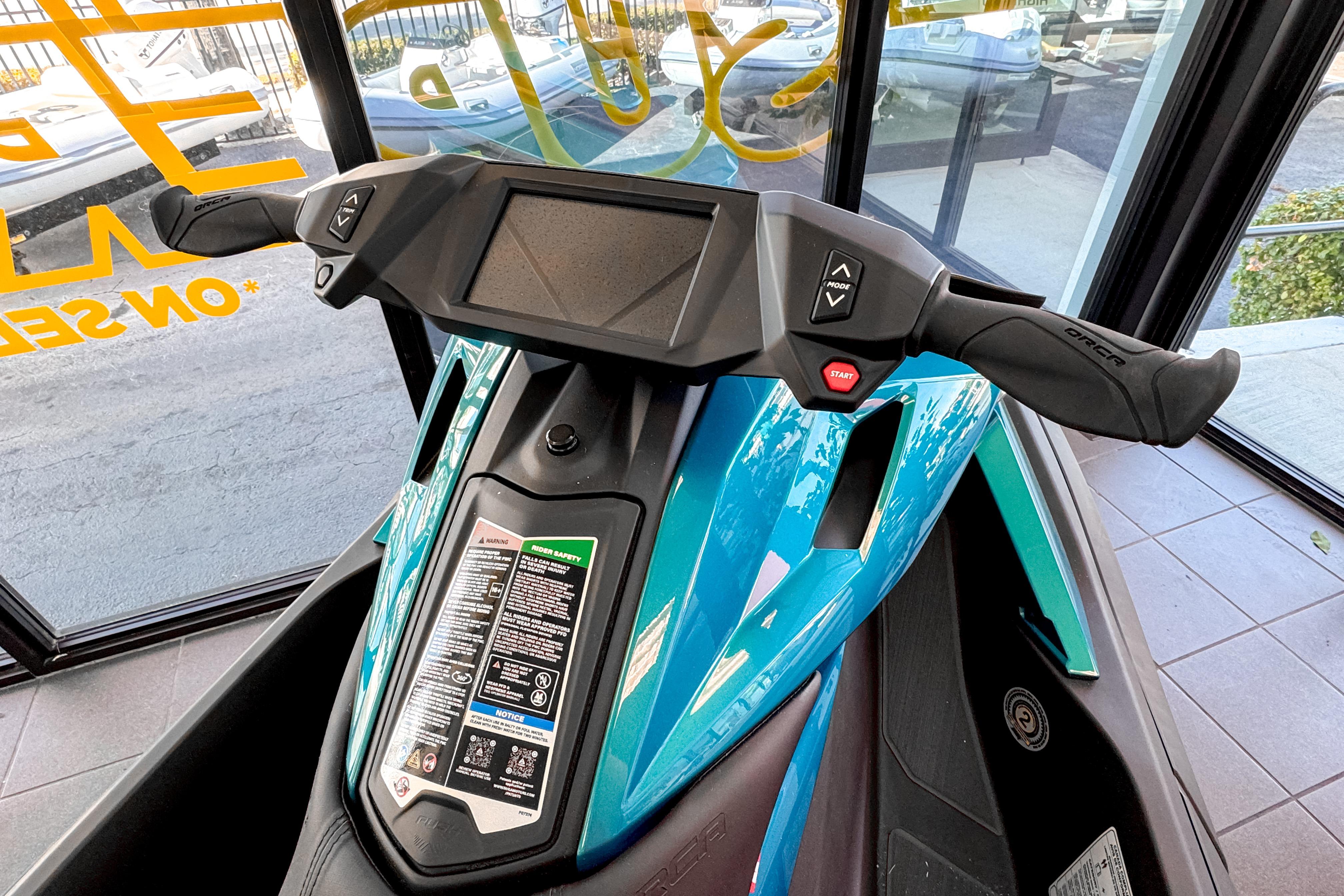 2025 Taiga Orca P2 jet ski dashboard in a showroom.