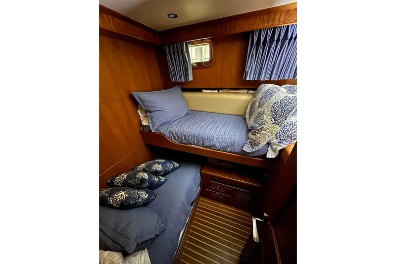 Prairie Sky Yacht Photos Pics Cozy cabin interior of 2008 Ocean Alexander 48C Classicco with bunk beds and nautical decor.