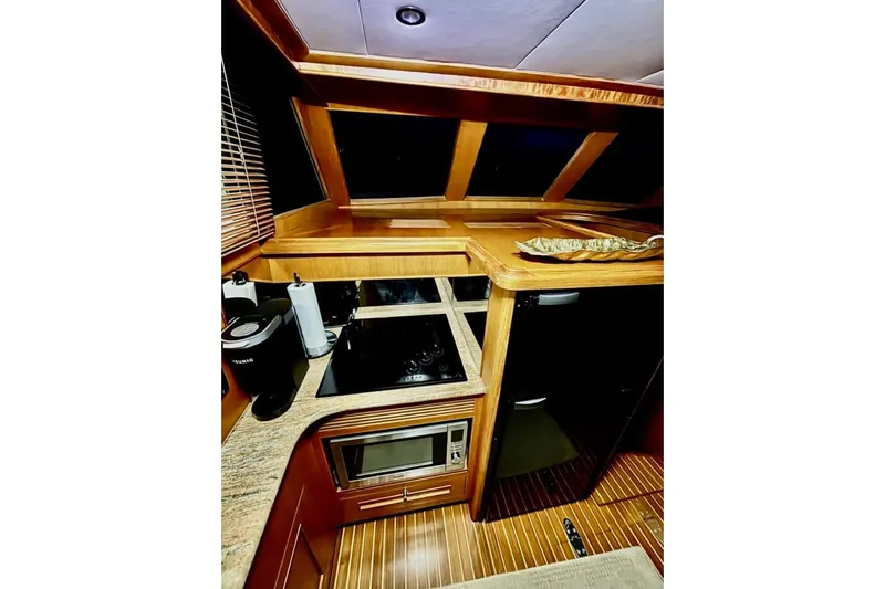 Prairie Sky Yacht Photos Pics Luxurious 2008 Ocean Alexander 48C Classicco yacht interior with modern kitchen amenities.