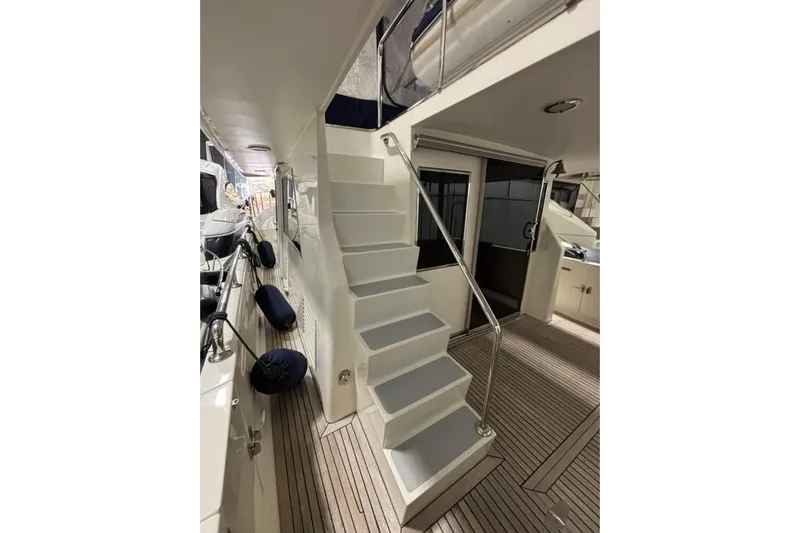 Prairie Sky Yacht Photos Pics Staircase on 2008 Ocean Alexander 48C Classicco yacht with teak flooring and sleek design.