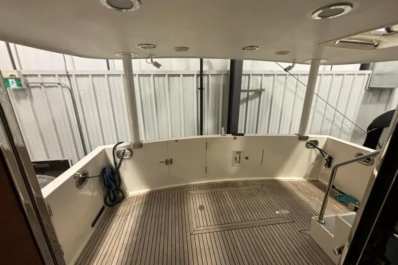 Prairie Sky Yacht Photos Pics 2008 Ocean Alexander 48C Classicco yacht deck with wood flooring and railing.