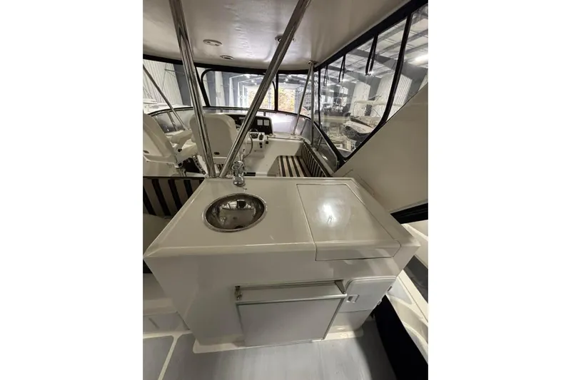 Prairie Sky Yacht Photos Pics 2008 Ocean Alexander 48C Classicco yacht interior with sink and seating area.