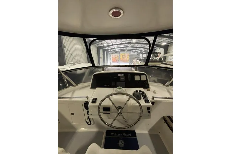 Prairie Sky Yacht Photos Pics Helm of 2008 Ocean Alexander 48C Classicco yacht in a storage facility.