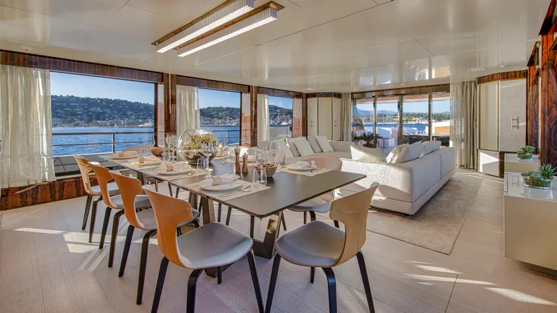 Oceanic 143 Yacht Photos Pics Luxurious interior of 2023 Canados 143 yacht with elegant dining area and scenic ocean views.