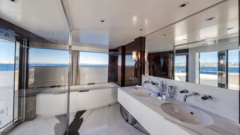 Oceanic 143 Yacht Photos Pics Luxurious bathroom on 2023 Canados 143 yacht with ocean view.
