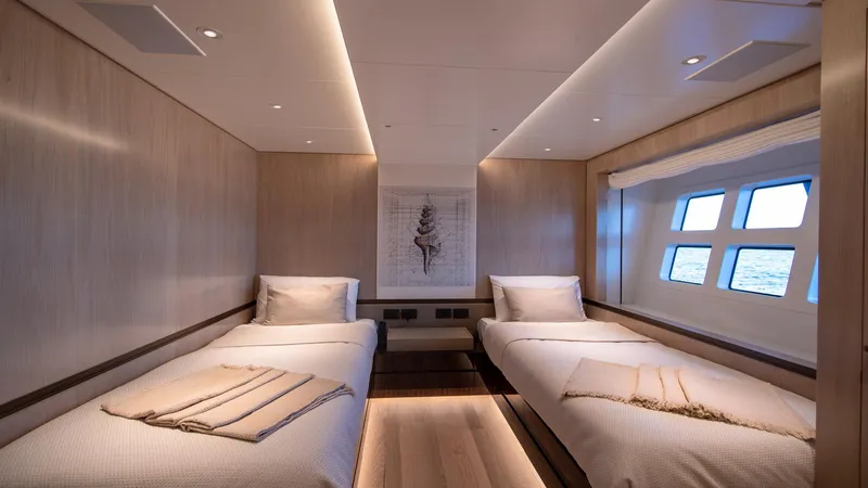 Oceanic 143 Yacht Photos Pics Luxurious twin cabin interior of 2023 Canados 143 yacht with modern design and ocean view.