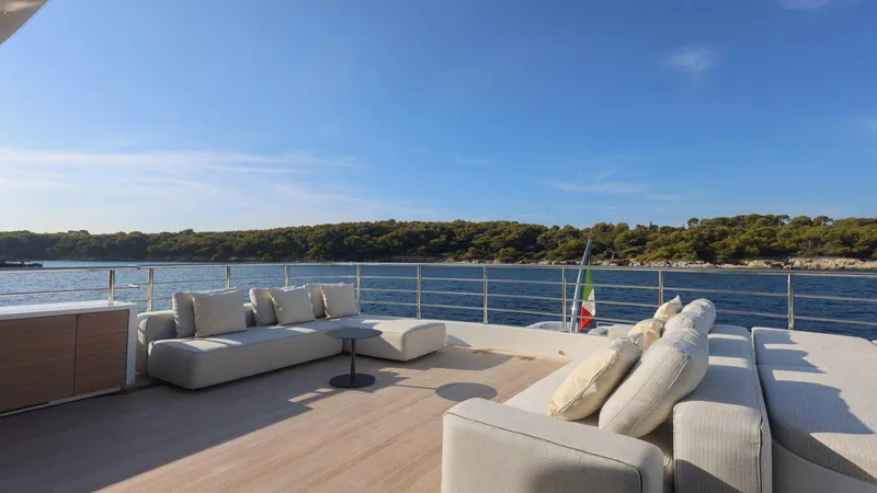 Oceanic 143 Yacht Photos Pics Luxurious Canados 143 yacht deck with elegant seating, overlooking serene waters and lush coastline, 2023 model.
