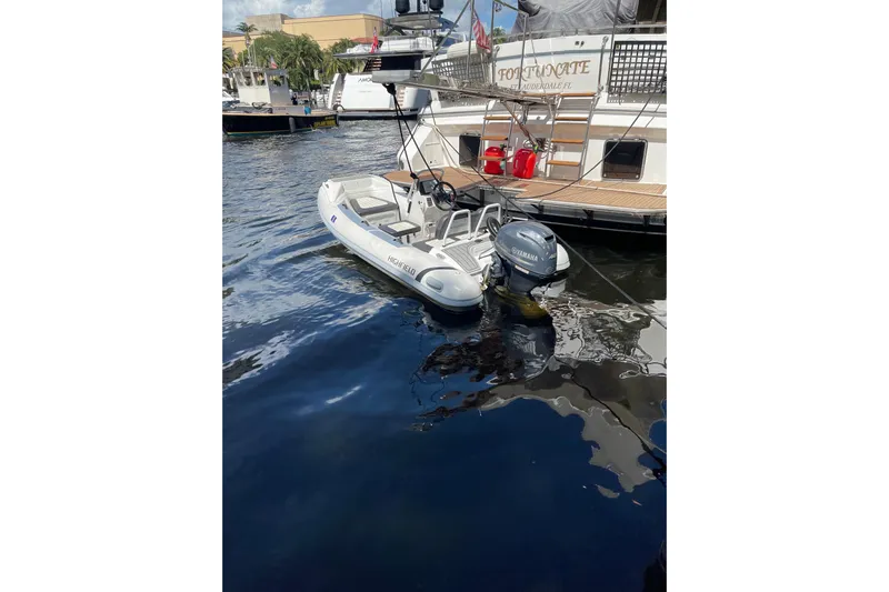 "fortunate" Yacht Photos Pics Highfield tender boat docked beside 1995 JOHNSON 65 Flybridge Motoryacht.