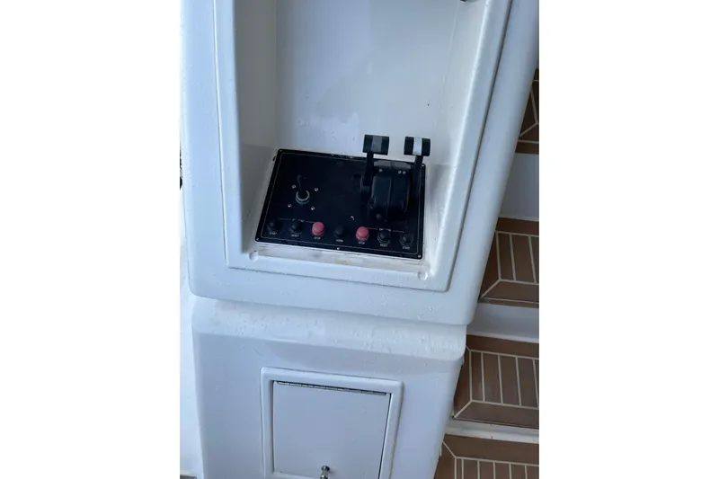 "fortunate" Yacht Photos Pics Control panel of a 1995 JOHNSON 65 Flybridge Motoryacht, featuring levers and buttons.