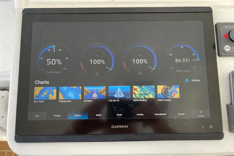"fortunate" Yacht Photos Pics Garmin display on 1995 JOHNSON 65 Flybridge Motoryacht showing water levels and charts.