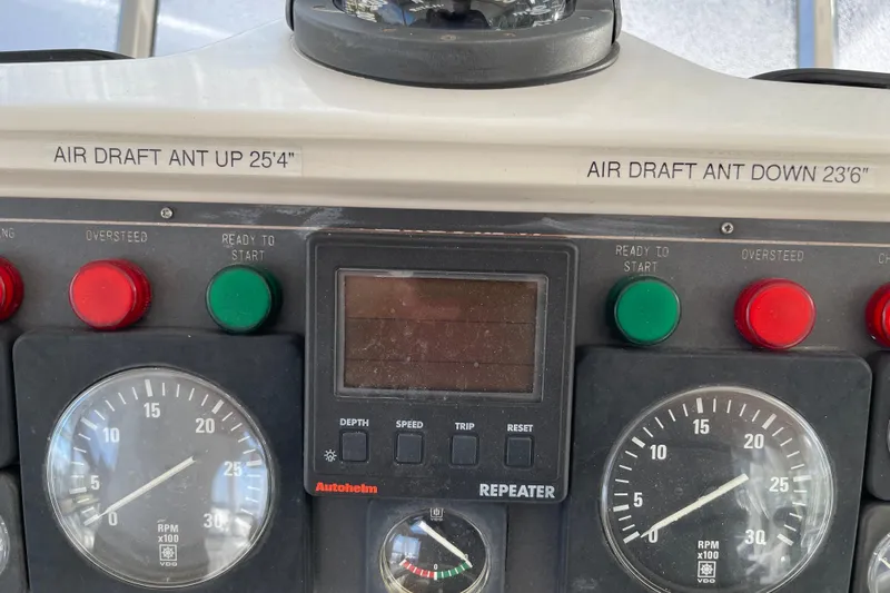 "fortunate" Yacht Photos Pics Control panel of a 1995 JOHNSON 65 Flybridge Motoryacht with air draft indicators.