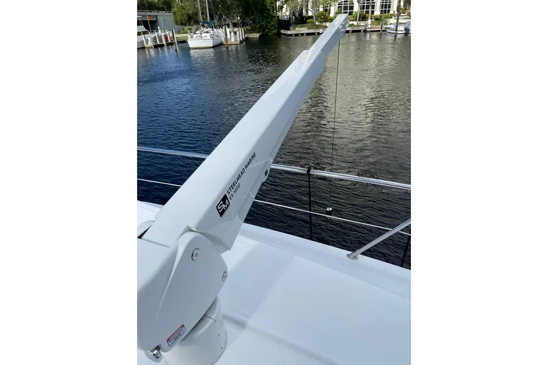 "fortunate" Yacht Photos Pics Flybridge of 1995 JOHNSON 65 Motoryacht with Steelhead Marine crane, docked by the water.