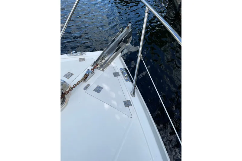"fortunate" Yacht Photos Pics Bow of 1995 JOHNSON 65 Flybridge Motoryacht with anchor and railing.