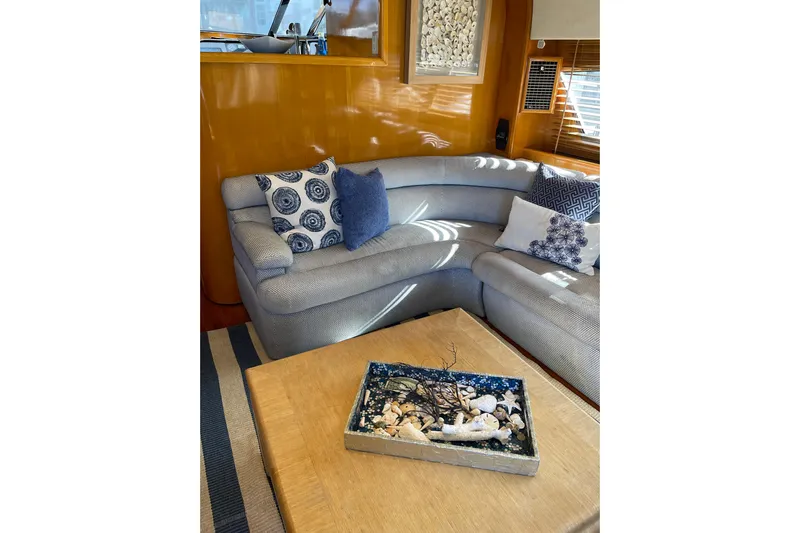 "fortunate" Yacht Photos Pics Luxurious interior of 1995 JOHNSON 65 Flybridge Motoryacht with elegant seating and decor.