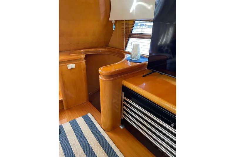 "fortunate" Yacht Photos Pics Luxurious interior of 1995 JOHNSON 65 Flybridge Motoryacht with wood finish and modern decor.
