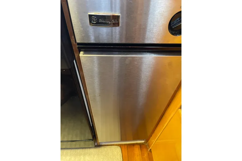 "fortunate" Yacht Photos Pics Stainless steel GE Monogram refrigerator on Johnson 65 Flybridge Motoryacht, 1995 model.