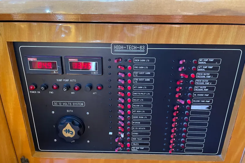"fortunate" Yacht Photos Pics Control panel of a 1995 JOHNSON 65 Flybridge Motoryacht, featuring various switches and indicators.