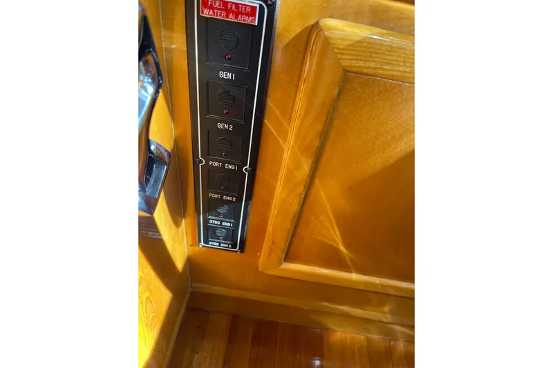 "fortunate" Yacht Photos Pics Control panel on 1995 JOHNSON 65 Flybridge Motoryacht with engine and generator switches.