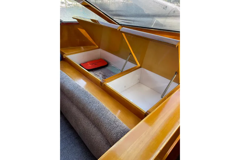 "fortunate" Yacht Photos Pics Storage compartments on a 1995 JOHNSON 65 Flybridge Motoryacht, showcasing interior design.