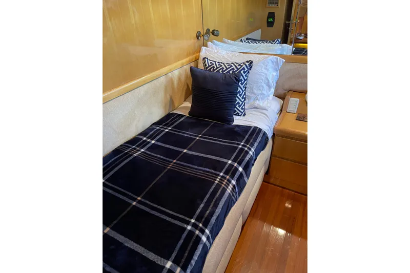 "fortunate" Yacht Photos Pics Luxurious cabin interior of 1995 JOHNSON 65 Flybridge Motoryacht with elegant bedding.