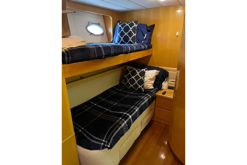 "fortunate" Yacht Photos Pics Bunk beds in 1995 JOHNSON 65 Flybridge Motoryacht cabin with nautical decor.
