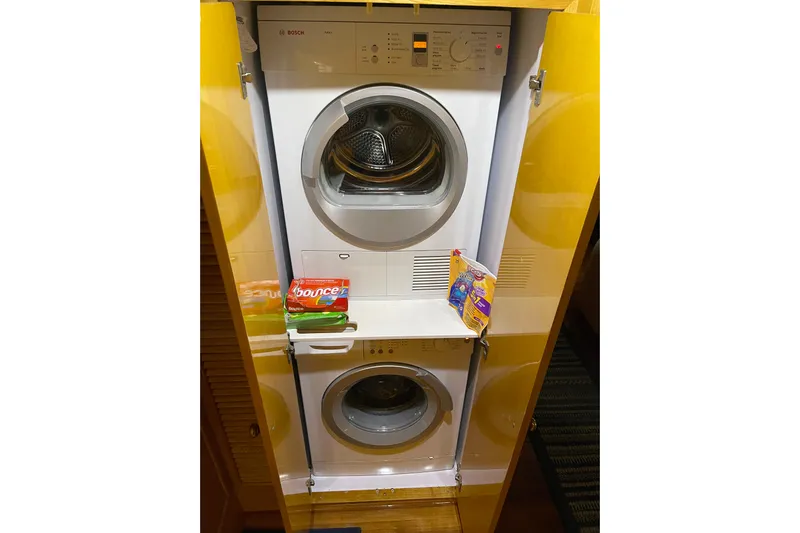 "fortunate" Yacht Photos Pics Stacked Bosch washer and dryer in a 1995 JOHNSON 65 Flybridge Motoryacht.