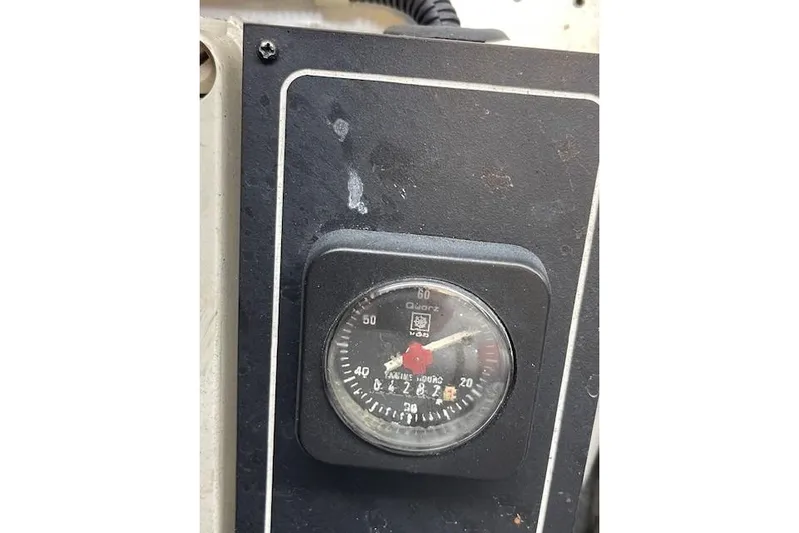 "fortunate" Yacht Photos Pics Hour meter on 1995 Johnson Flybridge Motoryacht dashboard, displaying engine hours.