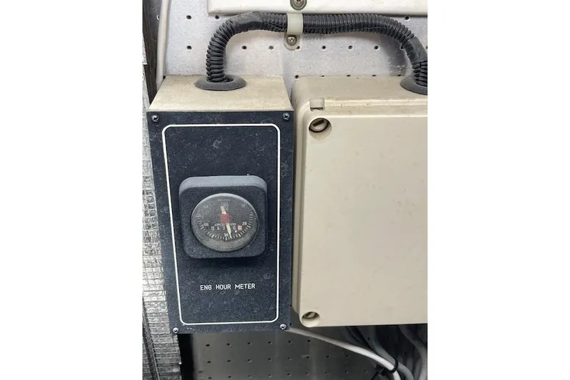 "fortunate" Yacht Photos Pics Engine hour meter on 1995 Johnson Flybridge Motoryacht dashboard.