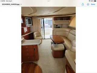  Yacht Photos Pics Luxurious interior of a 2004 Sea Ray 480 Sedan Bridge yacht with elegant seating and wood finishes.